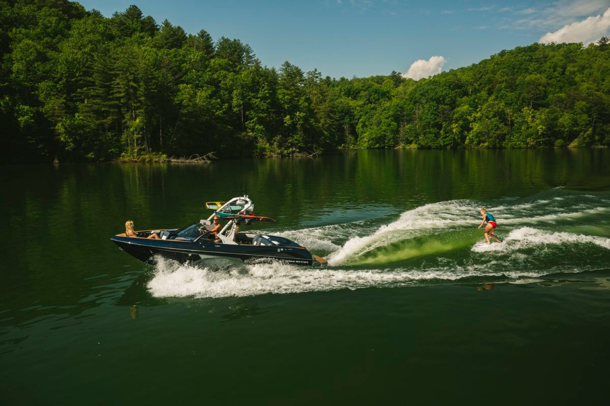 surfing behind malibu wakesetter