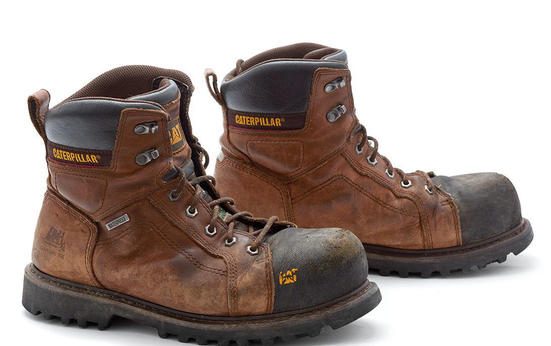 caterpillar work boots shot on white, tool