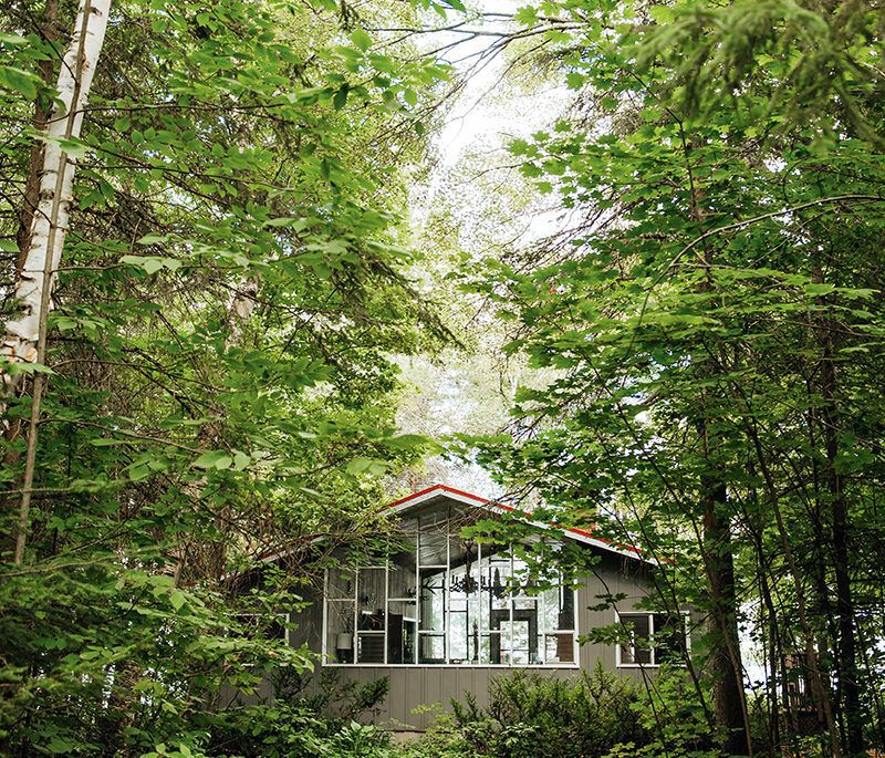 outside of Lija Skobe's cottage in the woods on balsam lake, grandparents