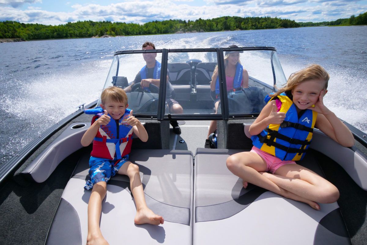 family enjoys a day on the boat