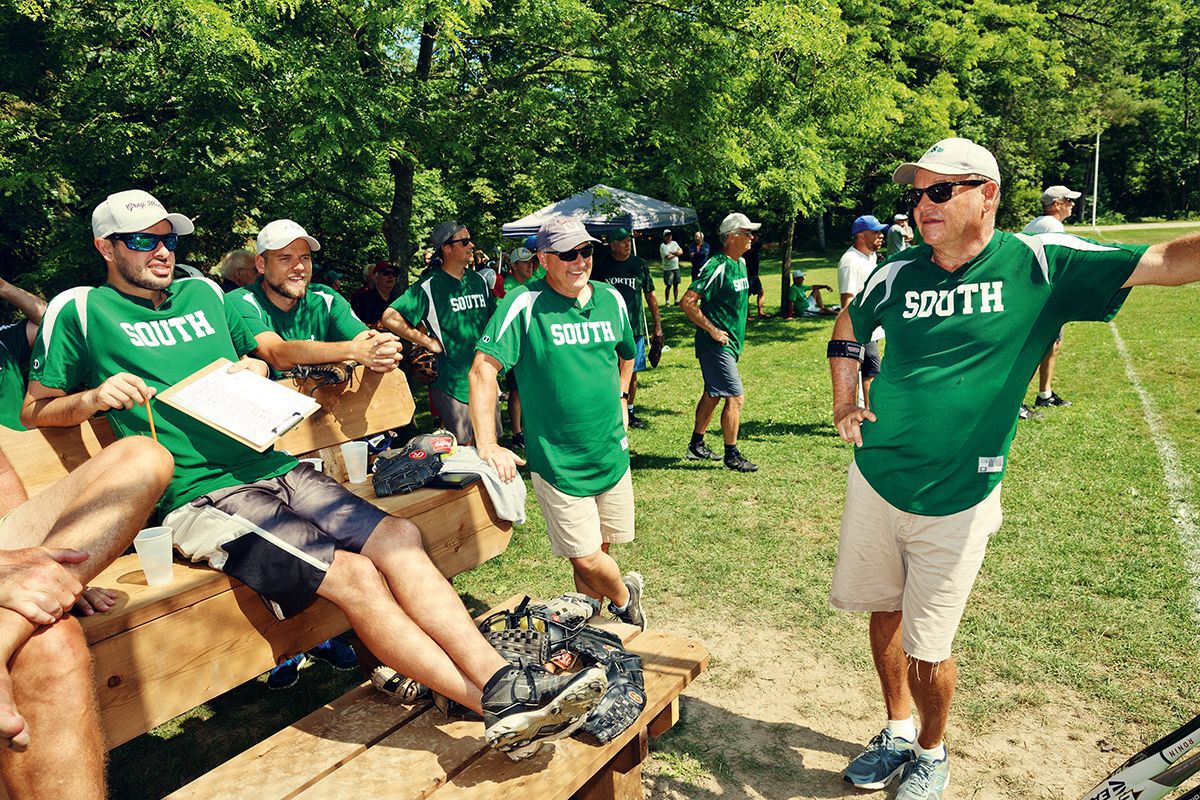 men standing in bruce beach baseball south shirts at the annual north-south game