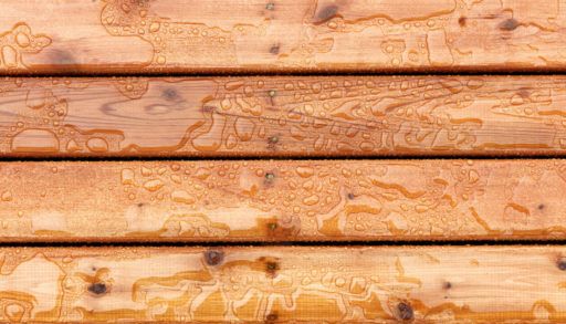 Close-up of deck boards with water drops on them