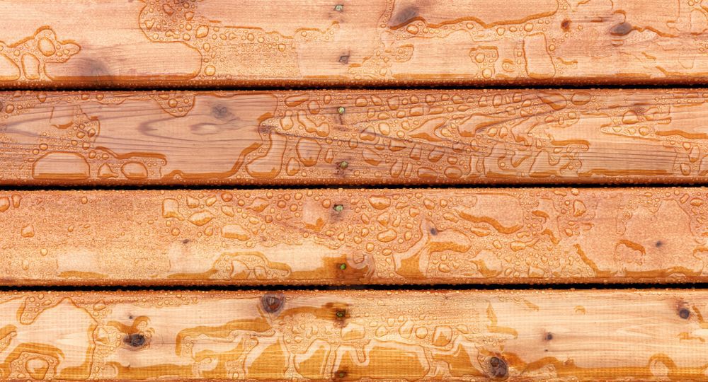 Close-up of deck boards with water drops on them