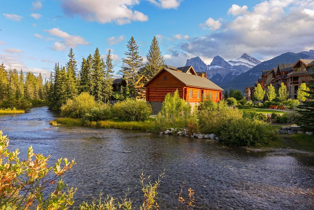 Spring Creek Alpine Village Landscape and Autumn Colors with Distant Three Sisters Mountain in Town of Canmore, Alberta Foothills of Canadian Rockies, strata