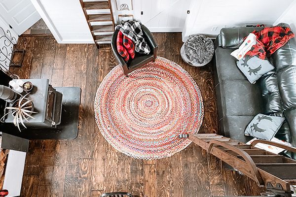 overhead shot looking down into the barn house living room, family