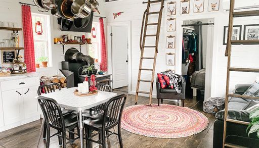 wide shot of the living room showing the ladder up to the lofts