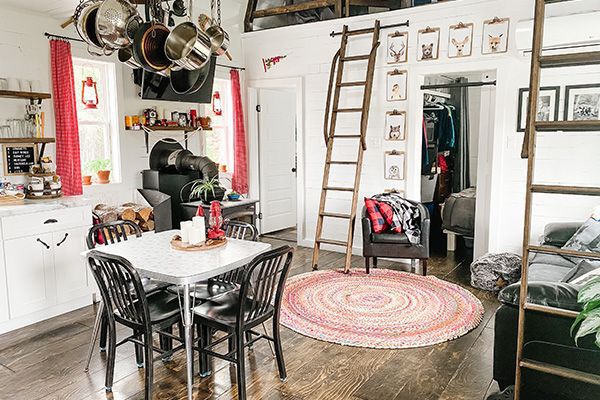 wide shot of the living room showing the ladder up to the lofts