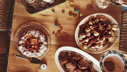 overhead shot of Amy Rosen's family Hanukkah brunch featuring latkes and applesauce