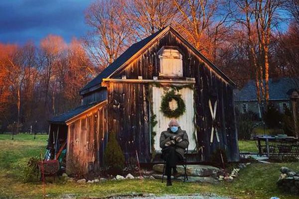 Bernie in front of cottage