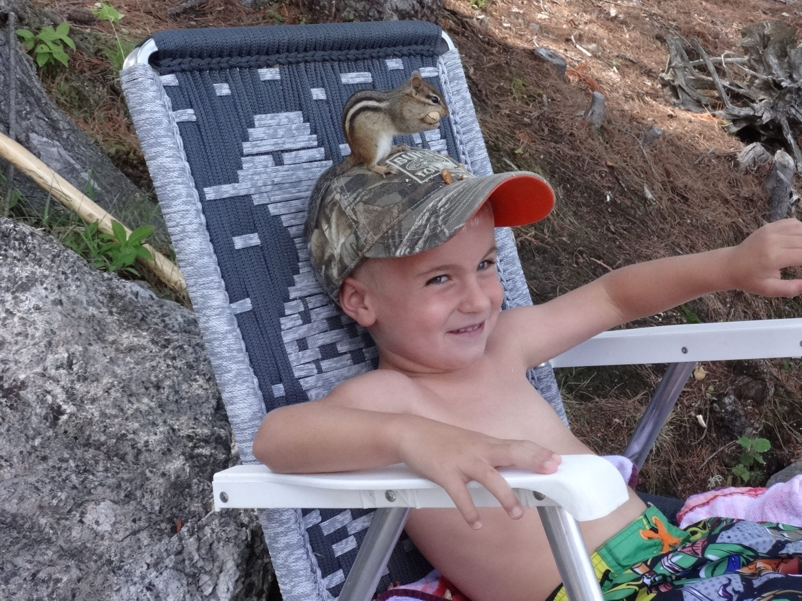 Chipmunk on little boy's head
