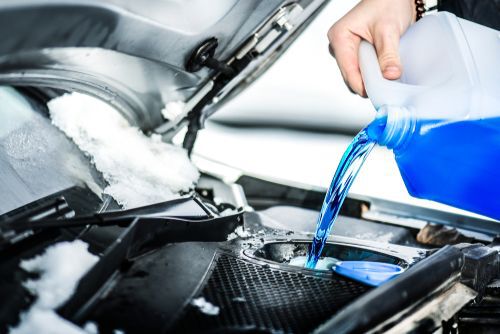 Pouring antifreeze liquid for washing car screen
