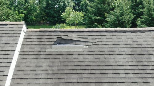 Aerial Drone Close Up of Roof Damage, Missing Shingles, spring maintenance