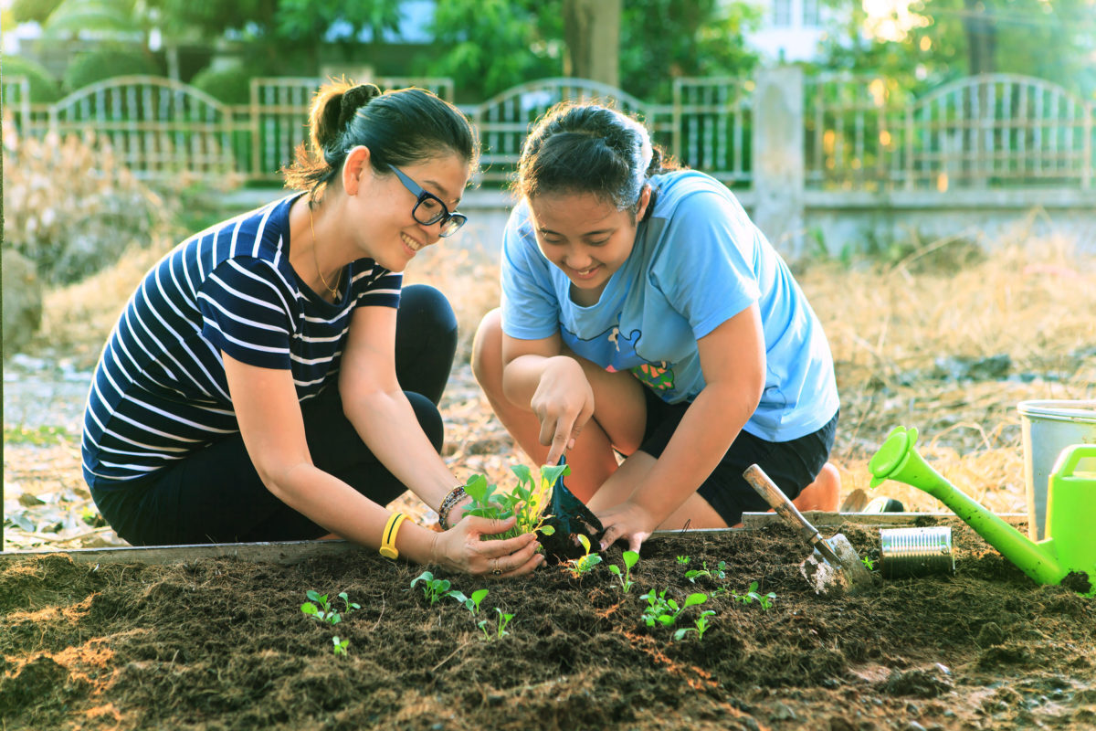 Mother and daughter gardening