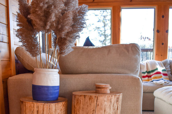 DIY tree stump tables in cottage at Crystal Lake