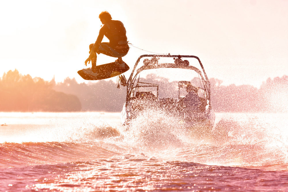 boat towing a wakeboarder