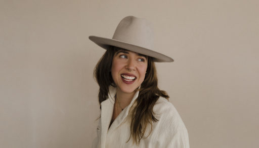A photo of Serena Ryder wearing a hat and smiling.