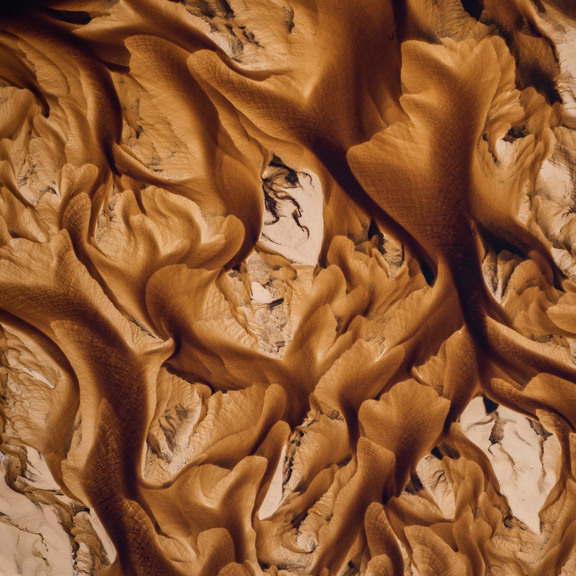 Patterns formed by mineral deposits trapped in lagoons.