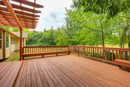 Exterior of horse ranch with empty wooden walkout deck. Northwest, USA, pressure washer