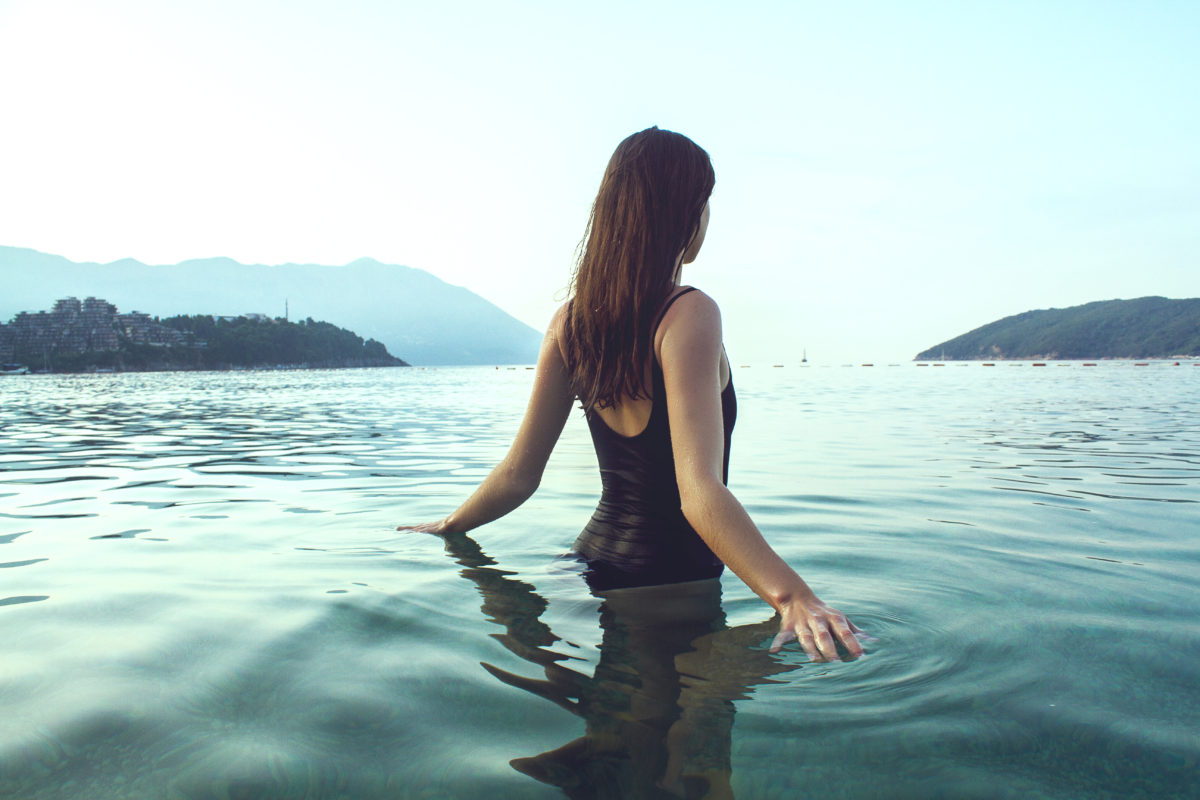 woman in lake in bathingsuit