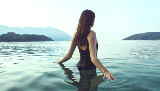woman in lake in bathingsuit