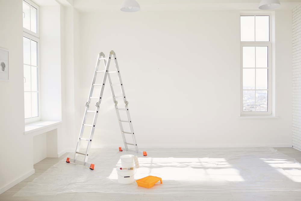 Stepladder in a room with white walls, painting