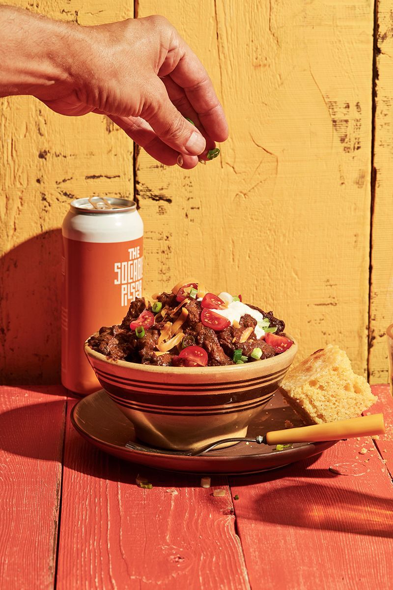 Chili in a bowl with beer