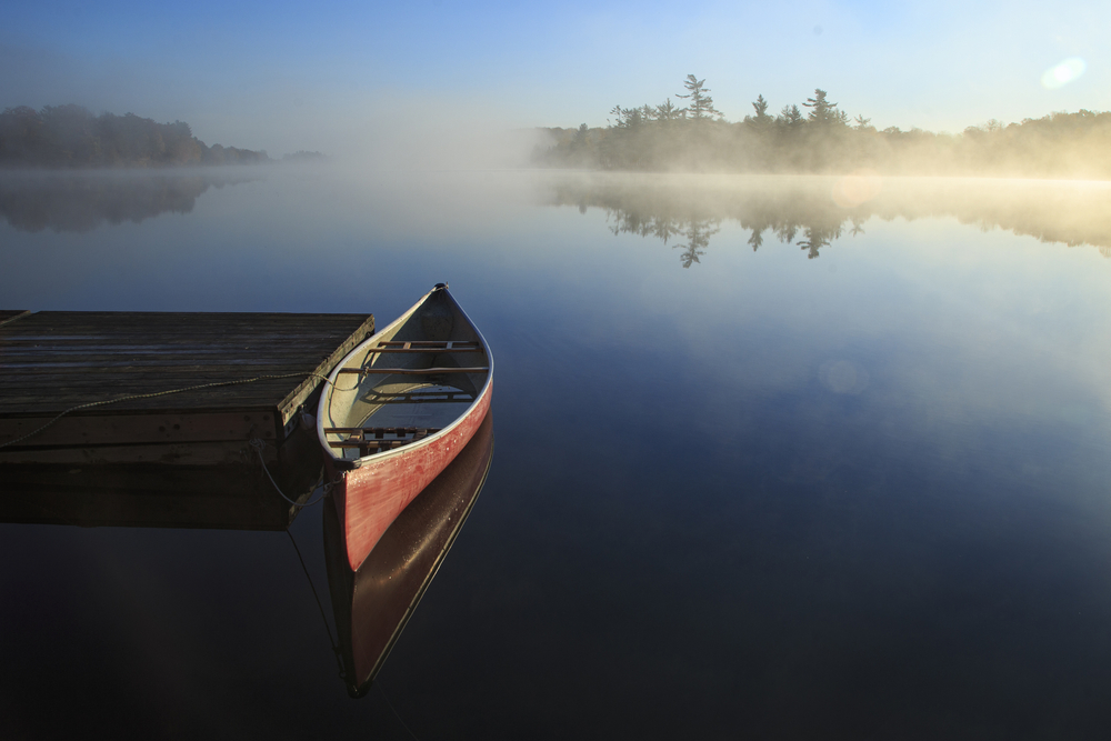 Beautiful canoe in still lake