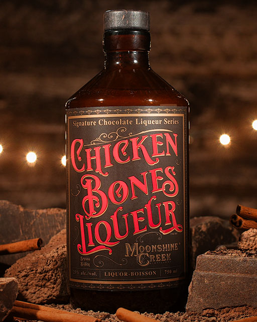 bottle of chicken bones liqueur on a wooden background
