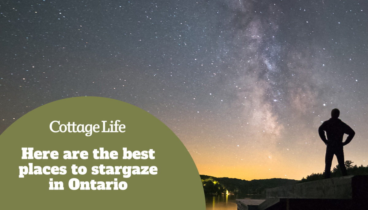 Man stargazing on a dock in Muskoka, Ontario, Canada