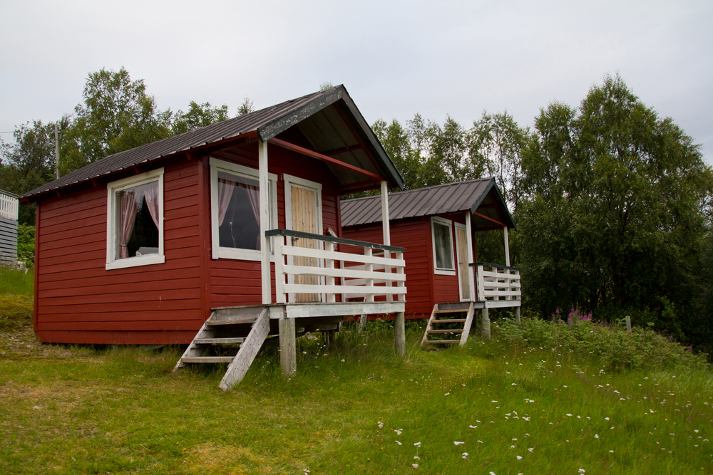 Two red cabins side by side