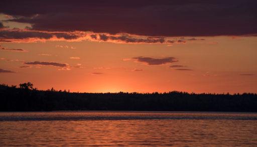Scenic view of lake at dusk, Kenora, Lake of the Woods, Ontario, Canada.