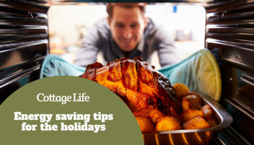 Man Taking Roast Turkey Out Of The Oven