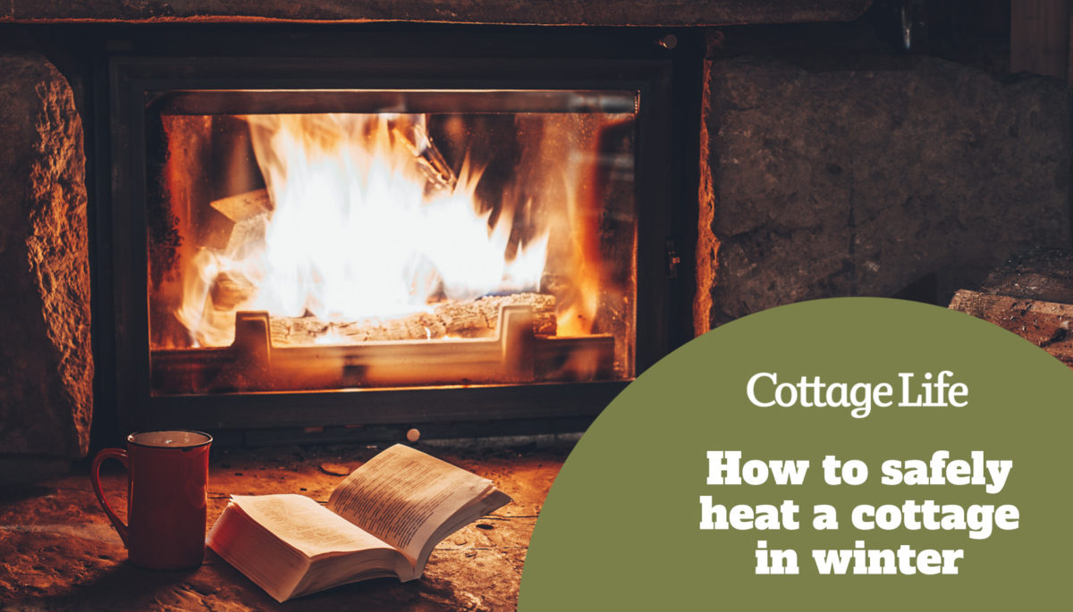 Open book by the Fireplace with Christmas ornaments. Open storybook lying on a wooden bench by the fireside. Cozy relaxed magical atmosphere in a chalet house decorated for Christmas. Holiday concept.