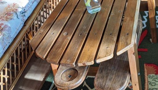 Muskoka chair turned into a table in a cottage sunroom