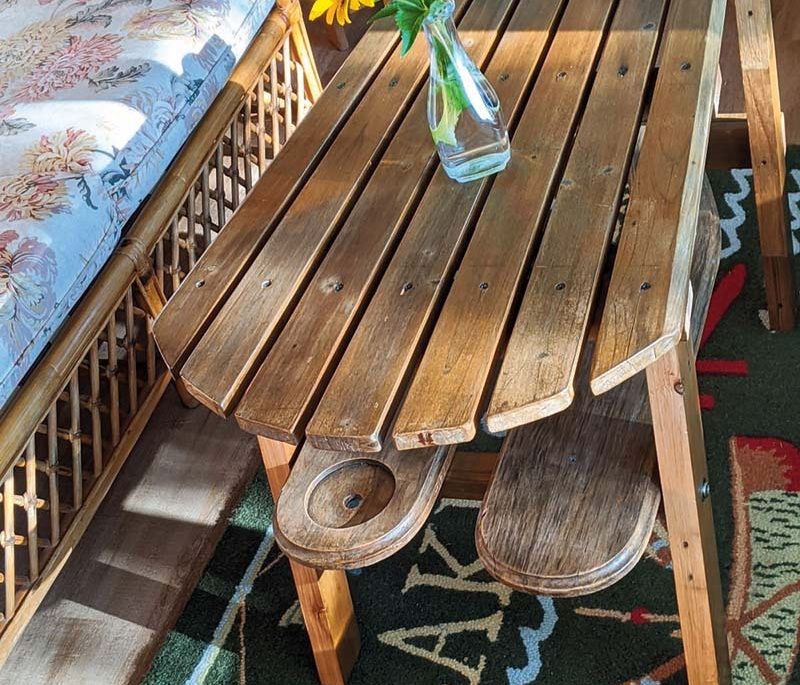 Muskoka chair turned into a table in a cottage sunroom