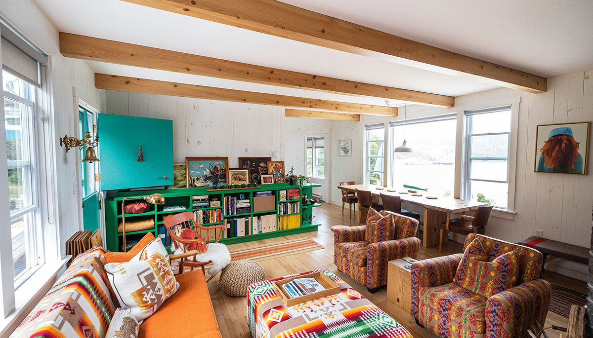 the living room of Pauline and Robbie's cottage heavy with prints and colours