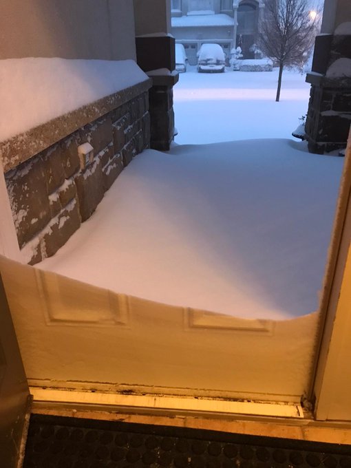Snow piled outside front door