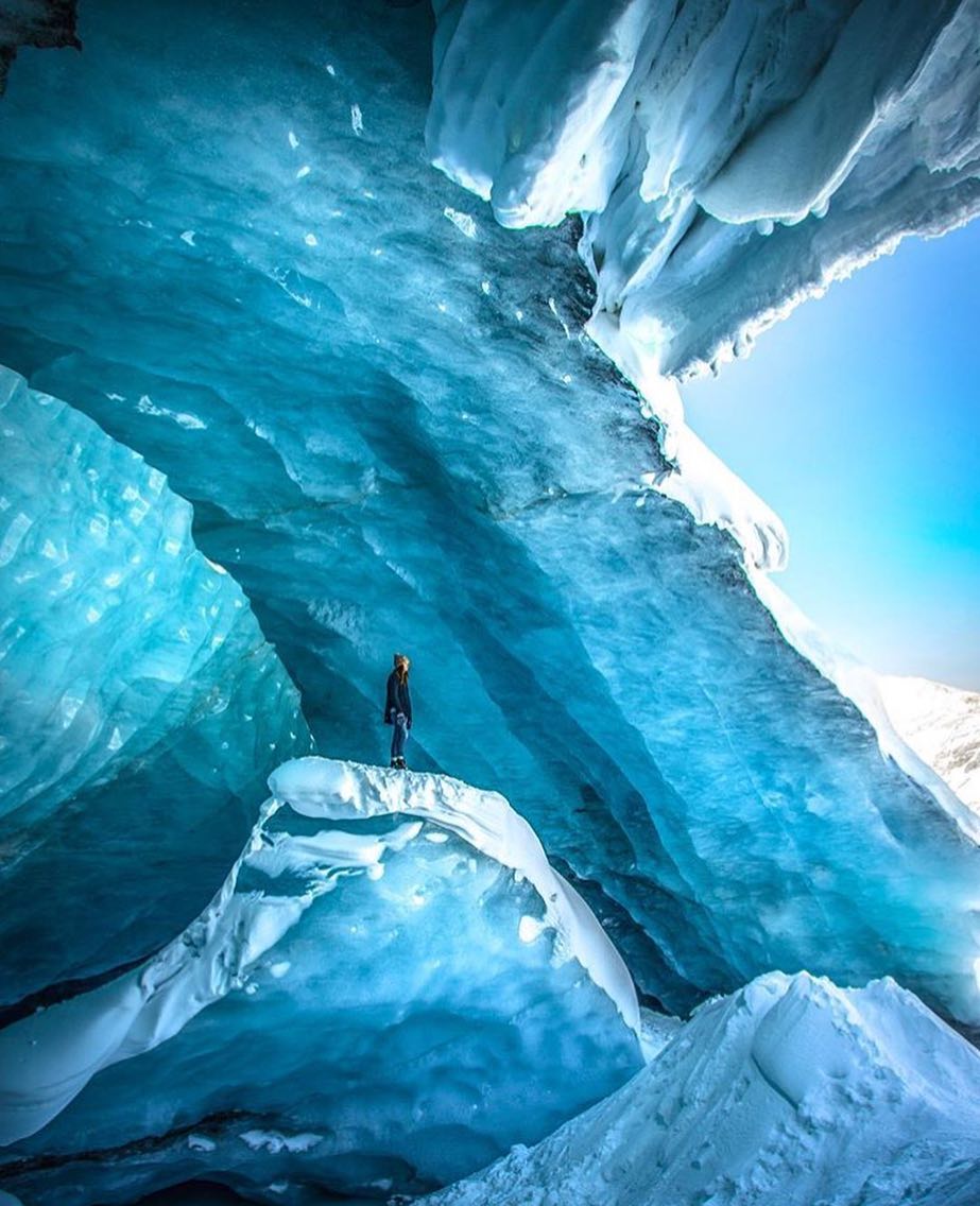 Person standing in an ice cave