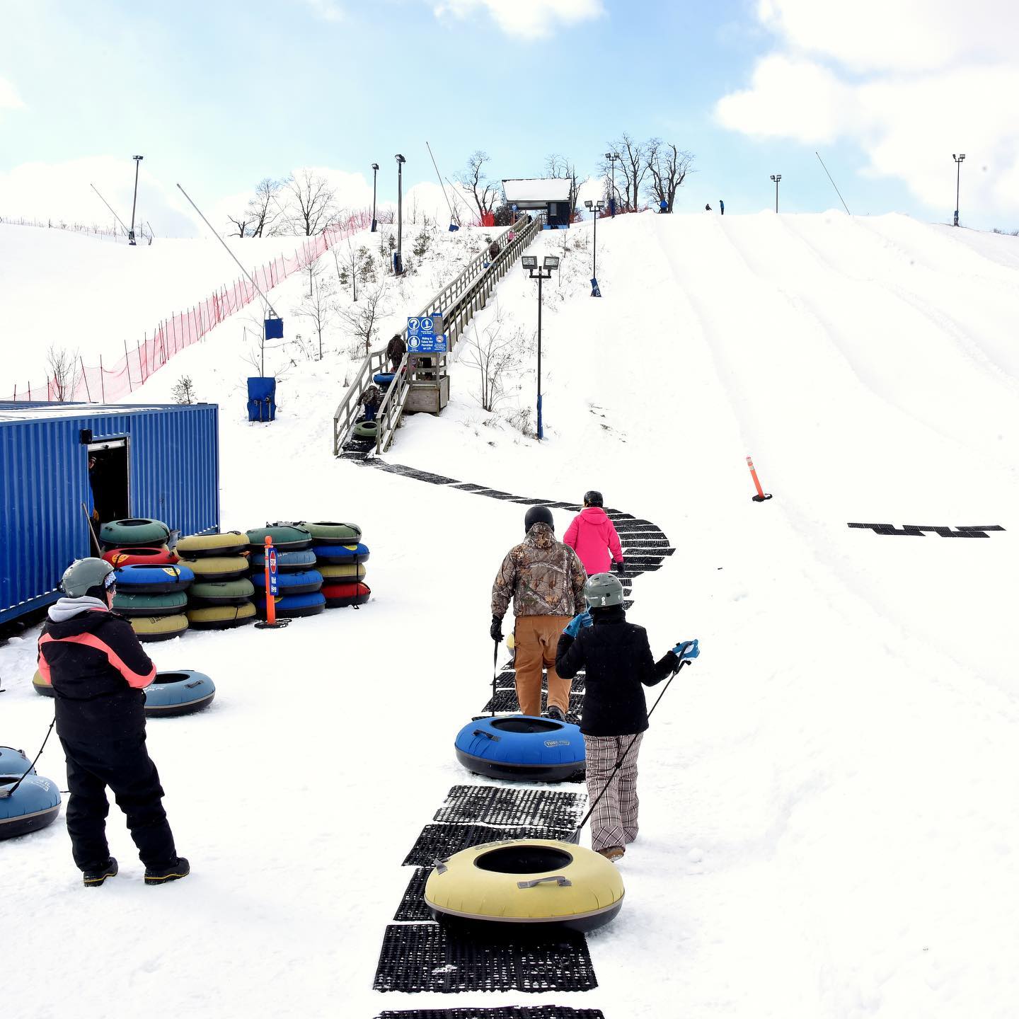 Kids lining up to snow tube