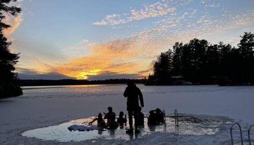 People going into frozen lake