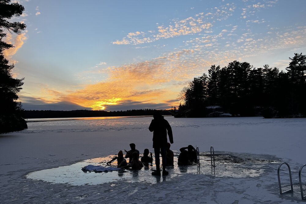 People going into frozen lake