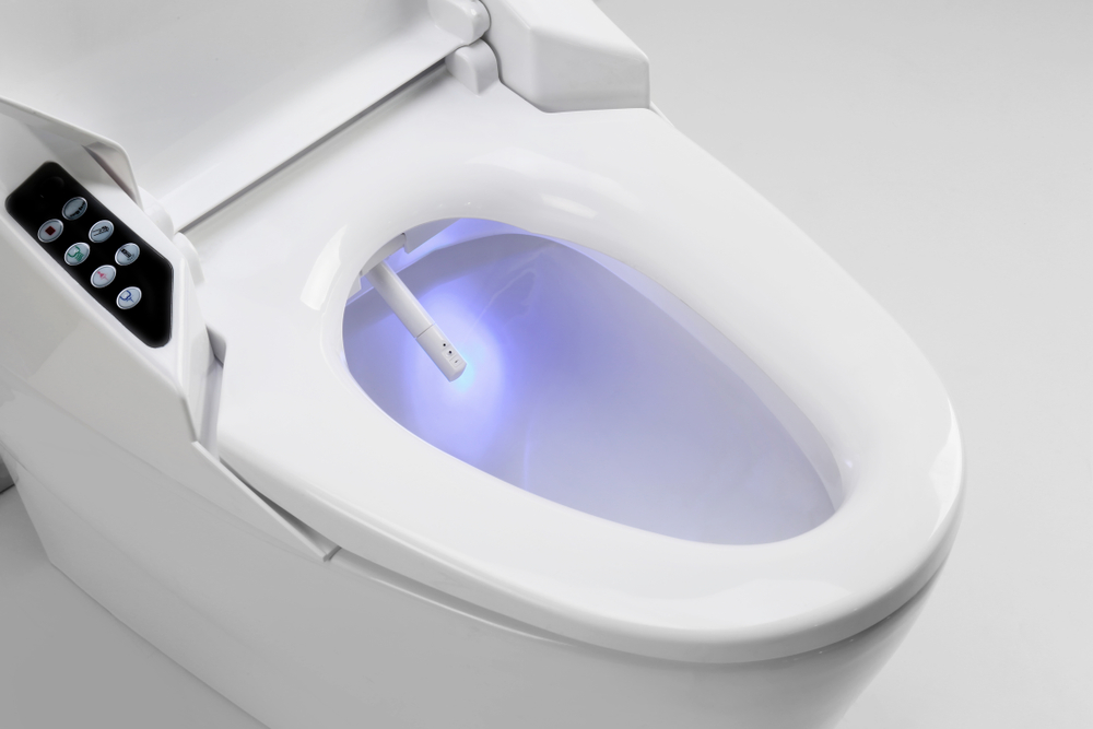 An electronic toilet bowl with a lit seat