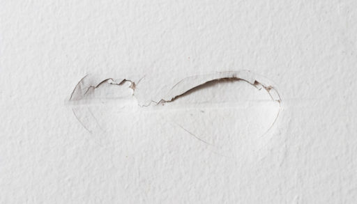 A portion of damaged drywall