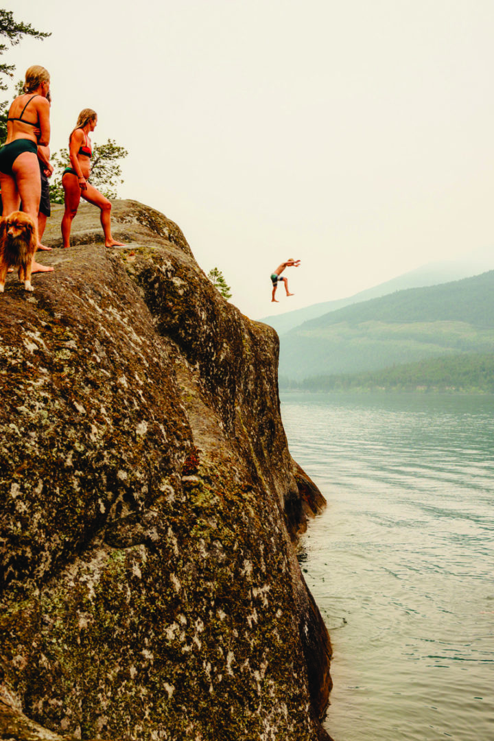 people cliff jumping on Anderson Lake