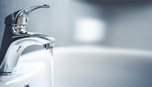 A faucet with water running from it