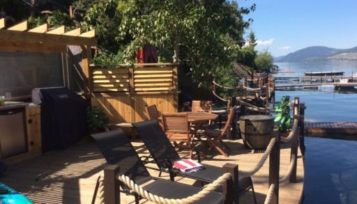 Deck with canoe and lounge chairs