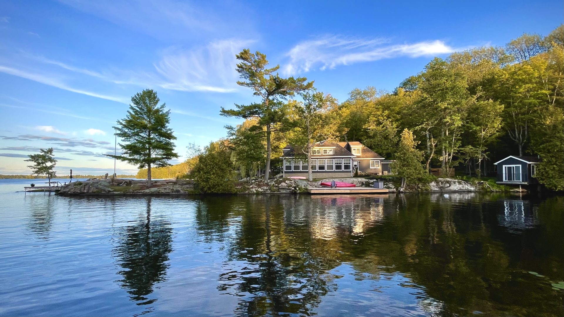 Photo contest entry of a private cottage tucked away in a forest on the bay.