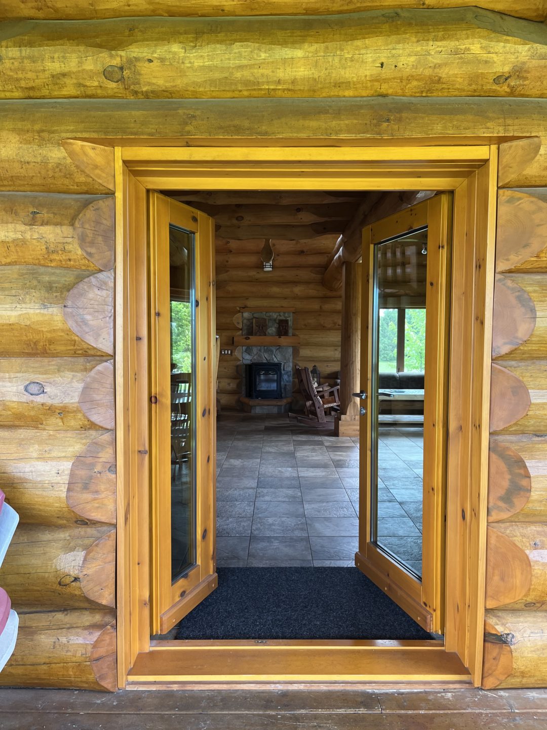 Wide doorways in log cabin.