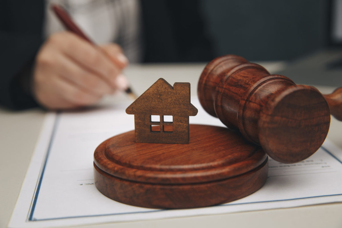 Model of house and a gavel.