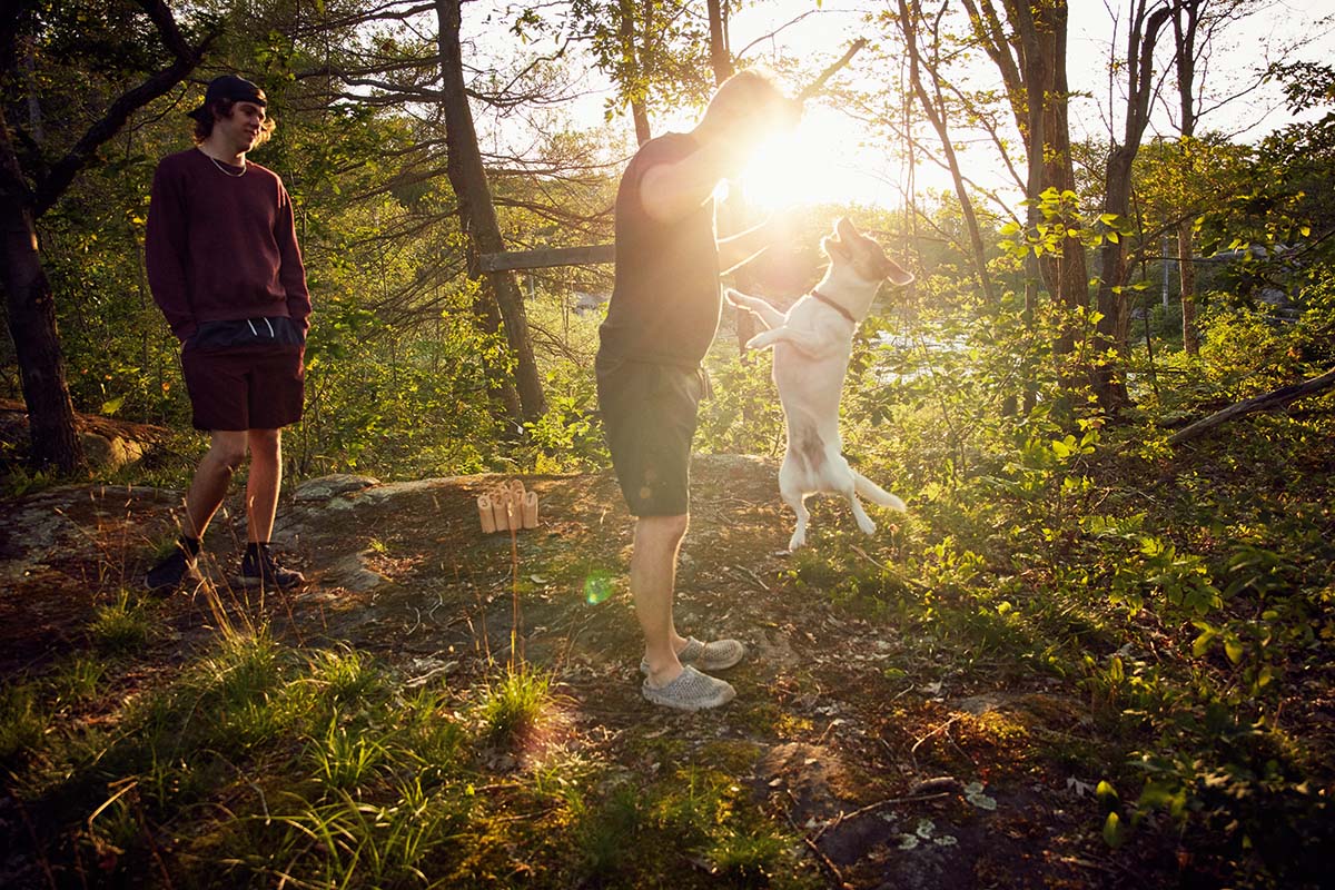 Andrew plays with his dog.